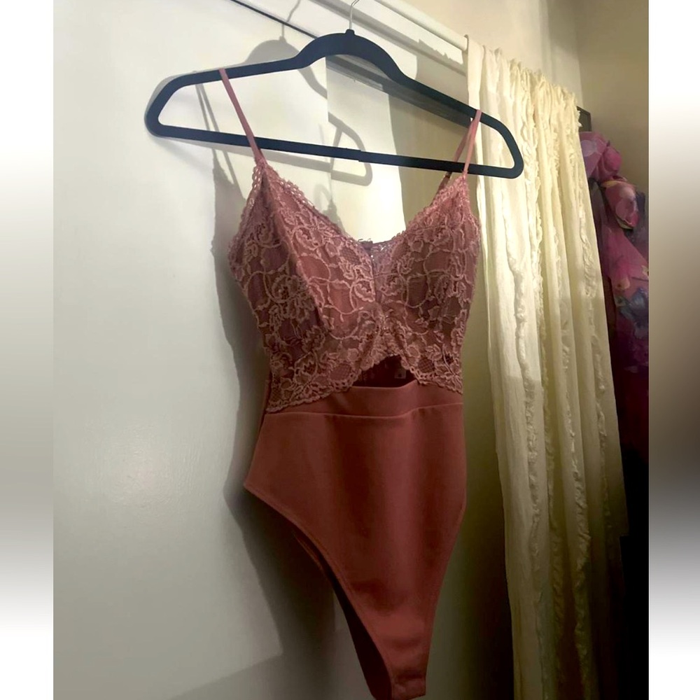 lace body suit in dusty rose hue with middle slit